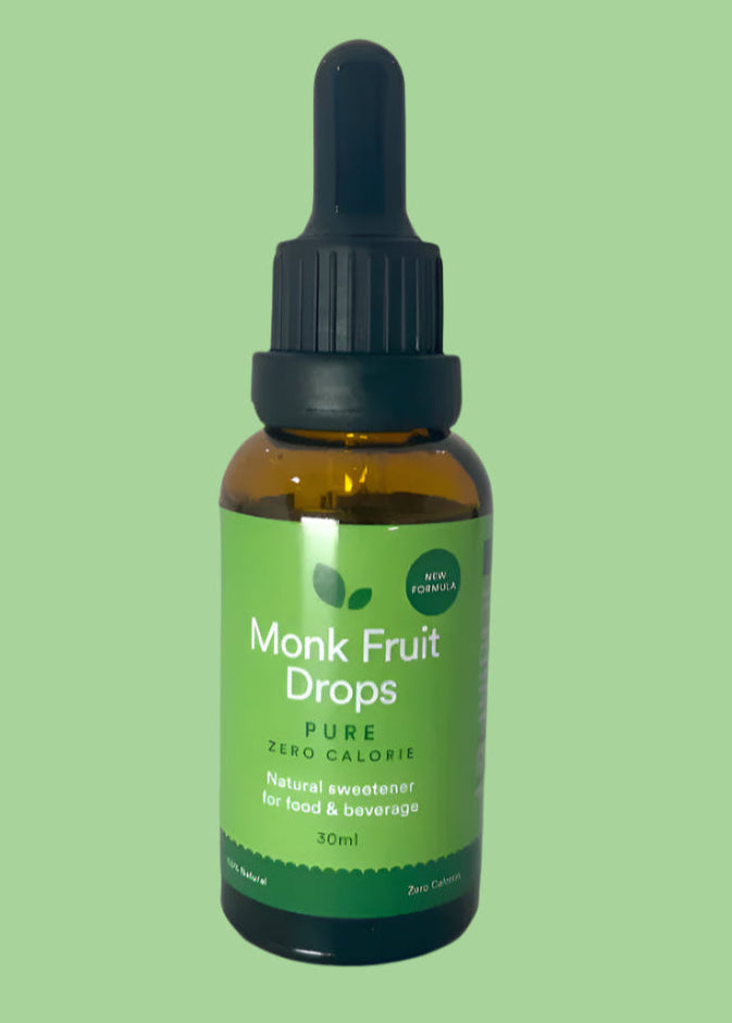 A bottle of Pure Liquid Monk Fruit Drops with a dropper, labeled for use in food and beverages.